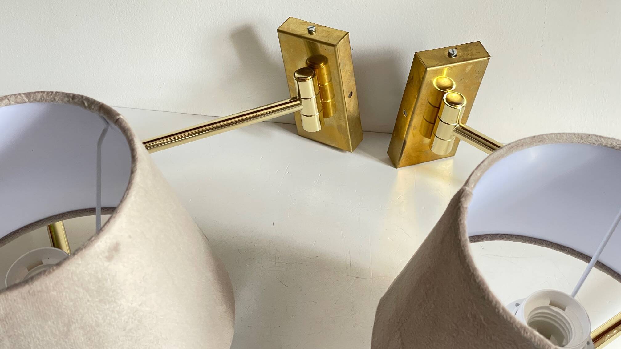 articulated brass and velvet wall light