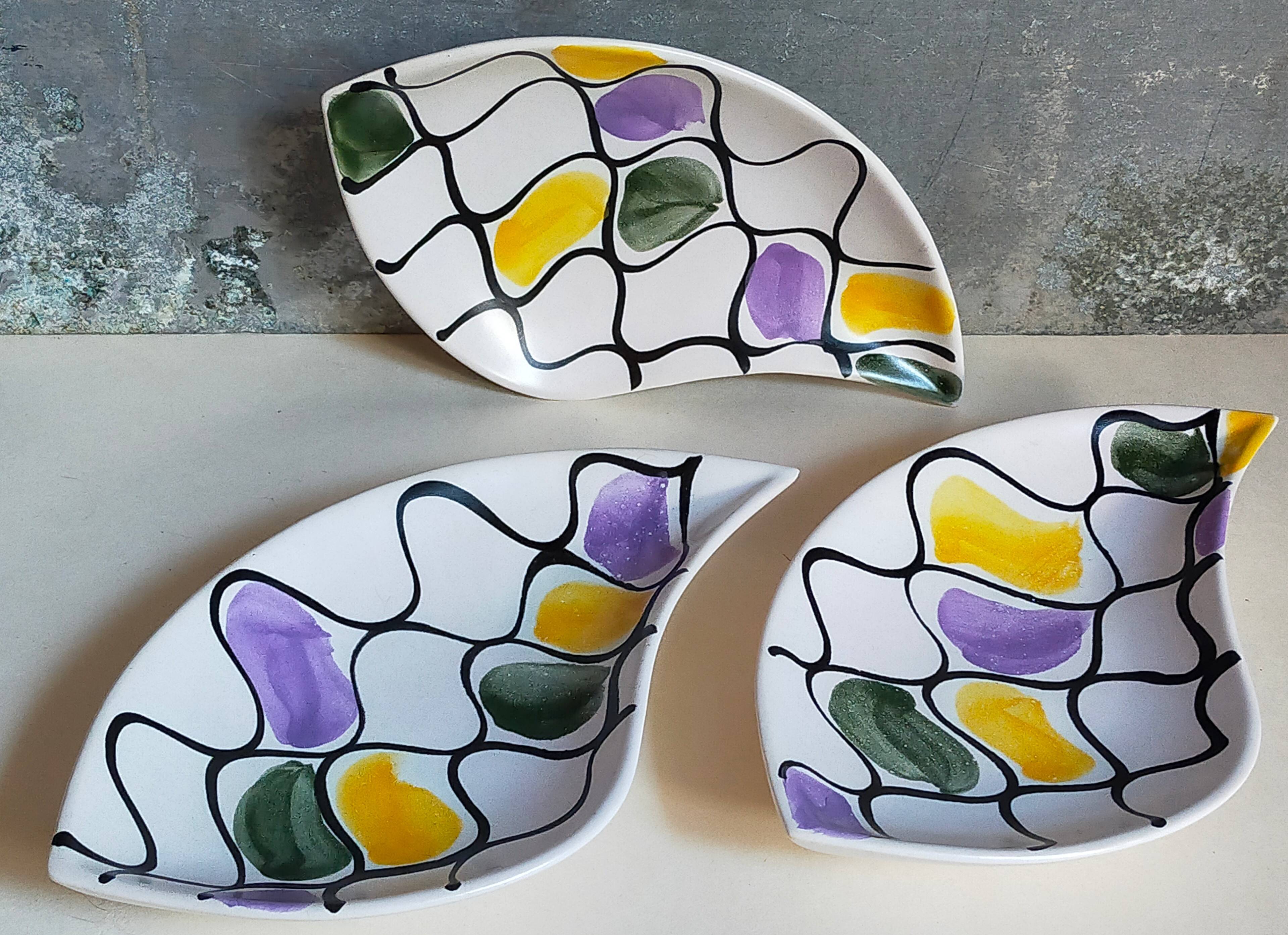 Three vintage free-form ceramic ravine dishes from the 1950s