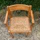 Brutalist chair in solid pine with a straw seat from the 1970s.