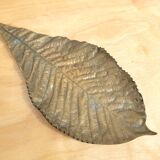 Bronze leaf-shaped pocket emptier