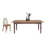 Vintage farmhouse table with turned legs.