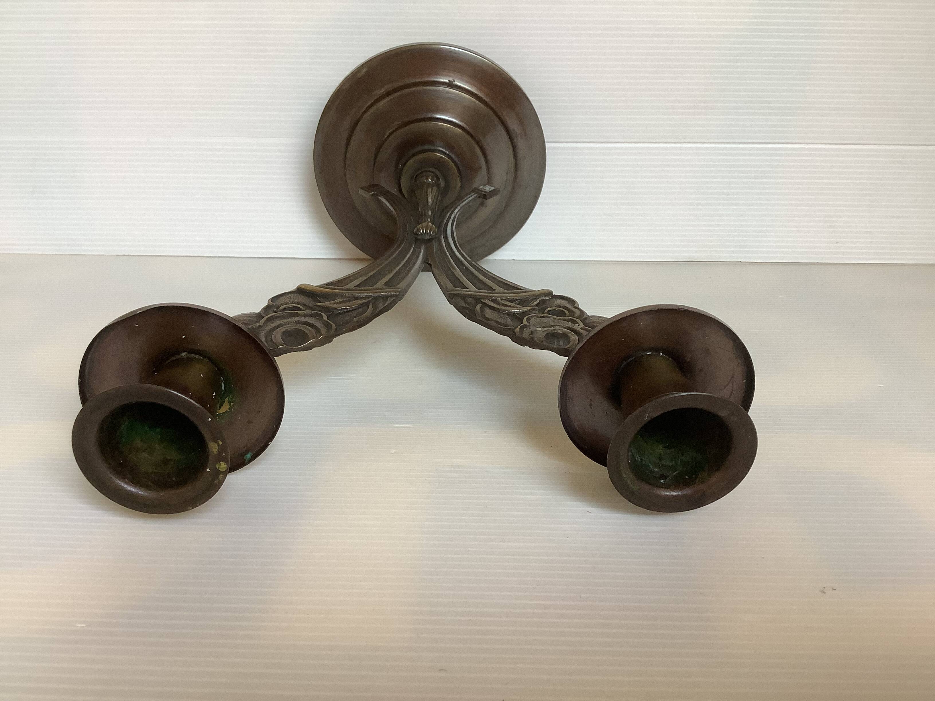 Candle holders in the shape of art deco butterfly wings