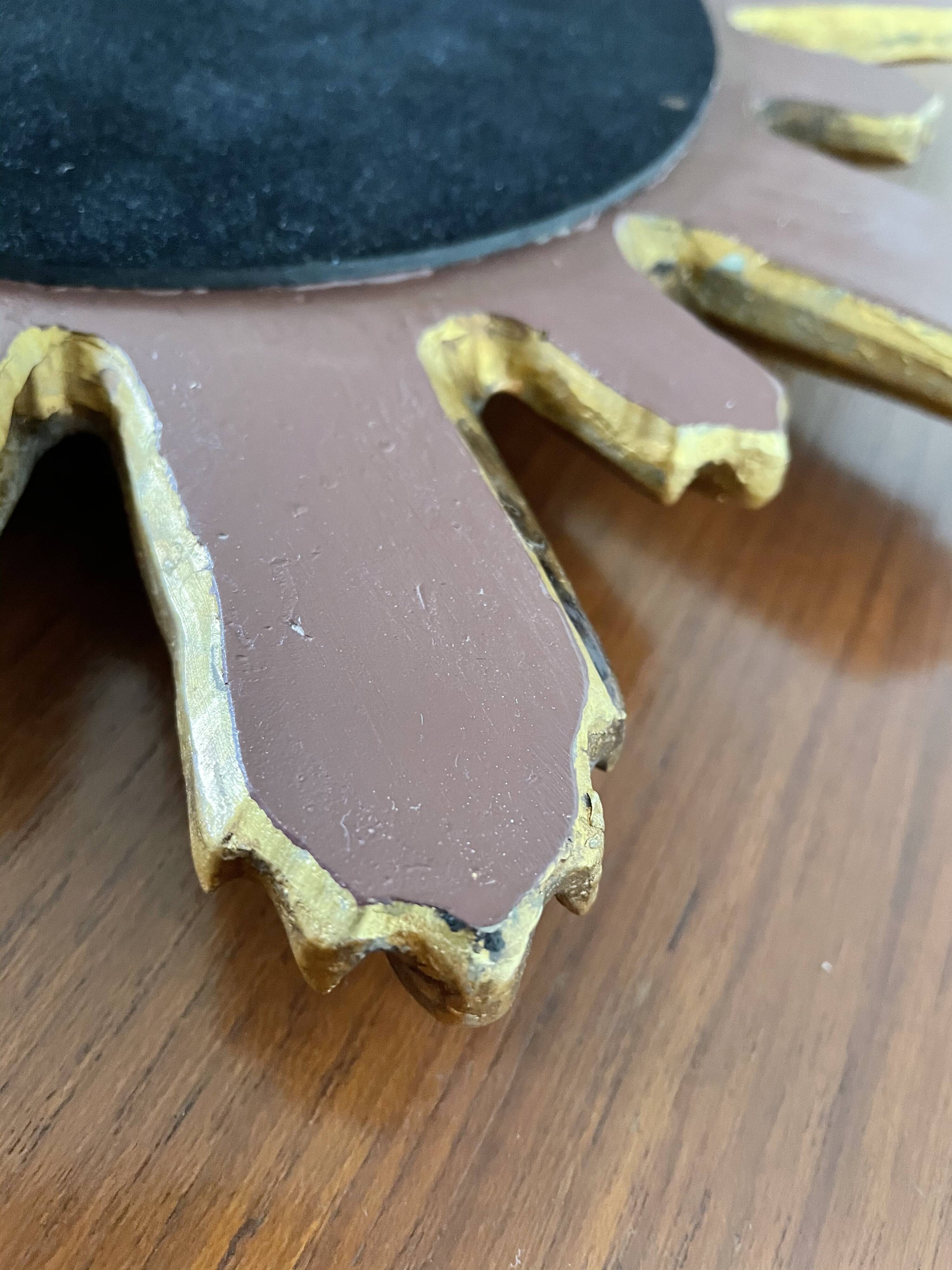 Vintage sun mirror in 60s/70s gold resin