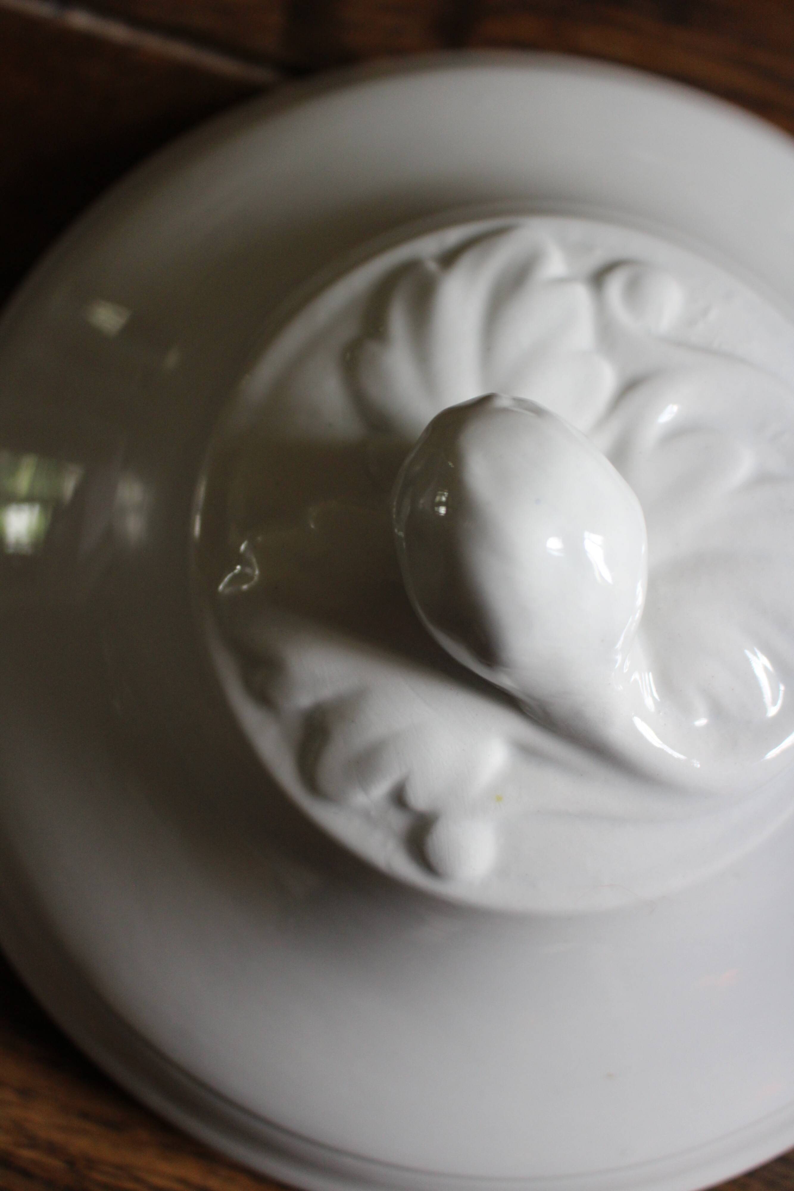 Antique soup tureen, white earthenware, with stopper decoration.