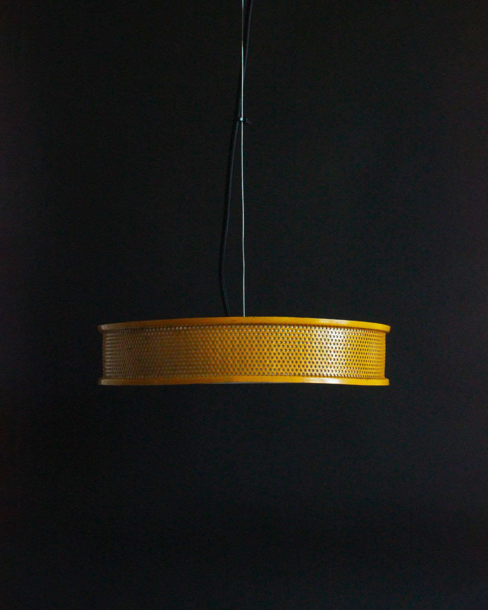 Yellow lacquered perforated metal pendant, in the style of Matégot or Biny.