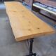Large bistro table with a wooden top and cast iron legs - 2m56