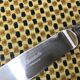 Christofle silver-plated knife, Océana model - gold rings