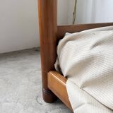 Brutalist style bed with chain and straw