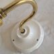 Brass flower and frosted glass sconce
