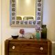 Large square ceramic mirror with floral decoration.