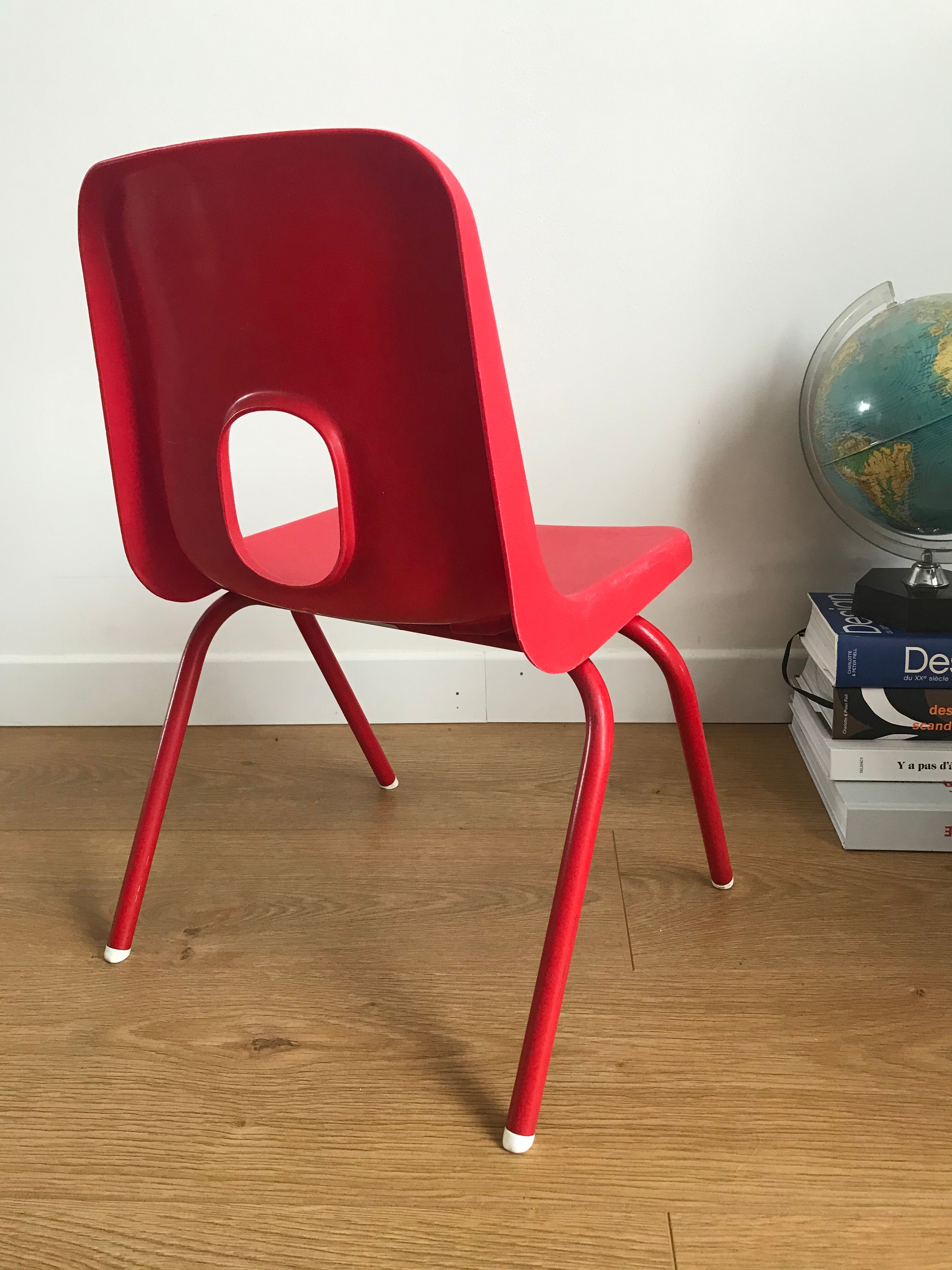 Red child chair by robin day for ikea