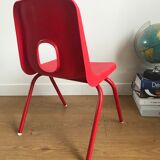 Red child chair by robin day for ikea