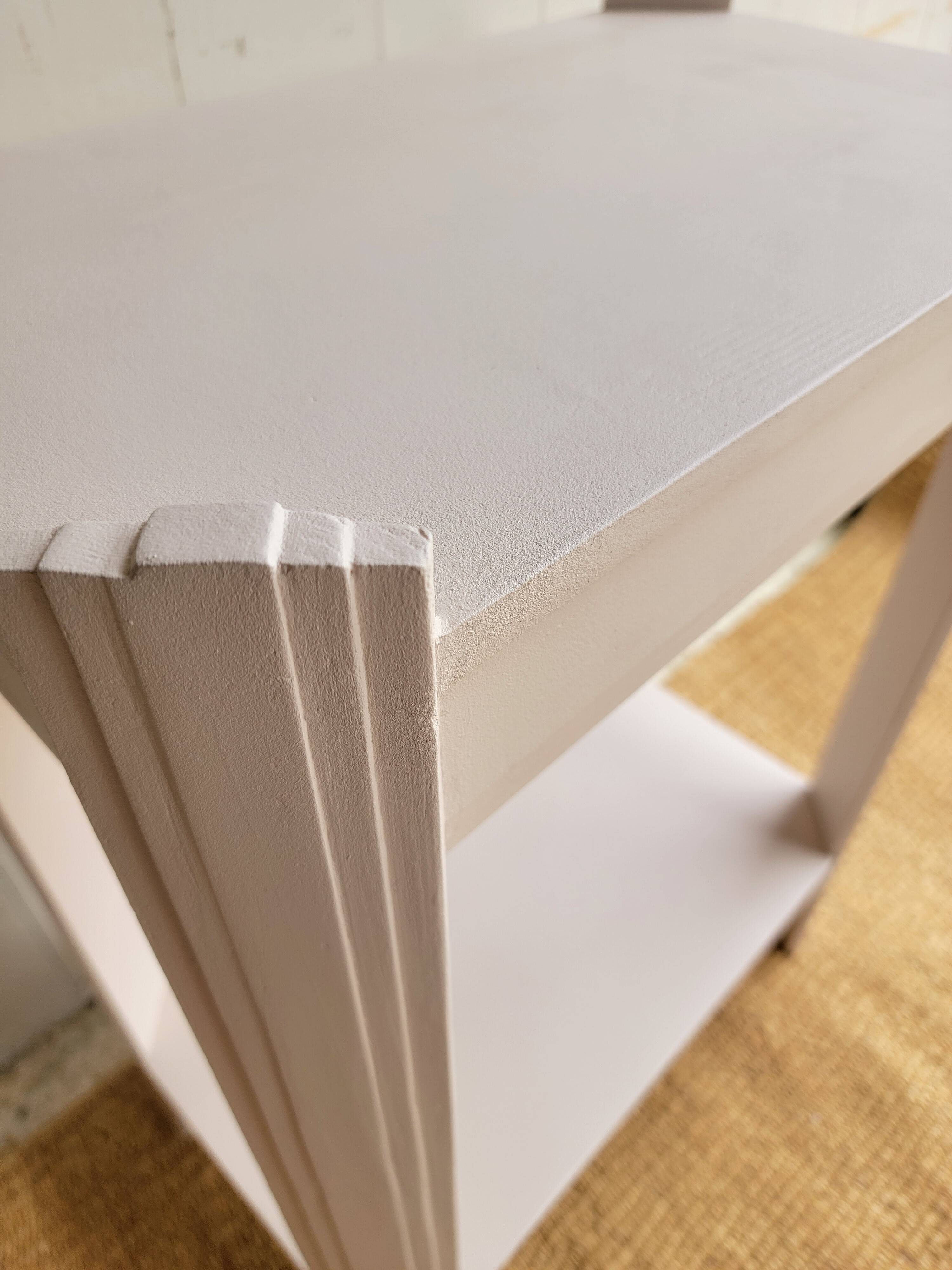 Small renovated Art Deco console in nude colour.