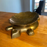 Empty brass turtle pocket