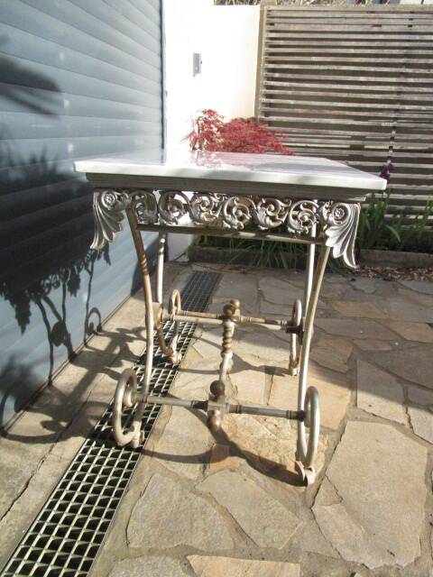 Butcher's table from the late 19th century, wrought iron, brass, and marble.