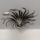 Silver wrought iron sunburst wall light from the 1960s.