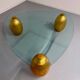 Vintage Italian design coffee table with a glass top and gold base, dating from the 1980s.