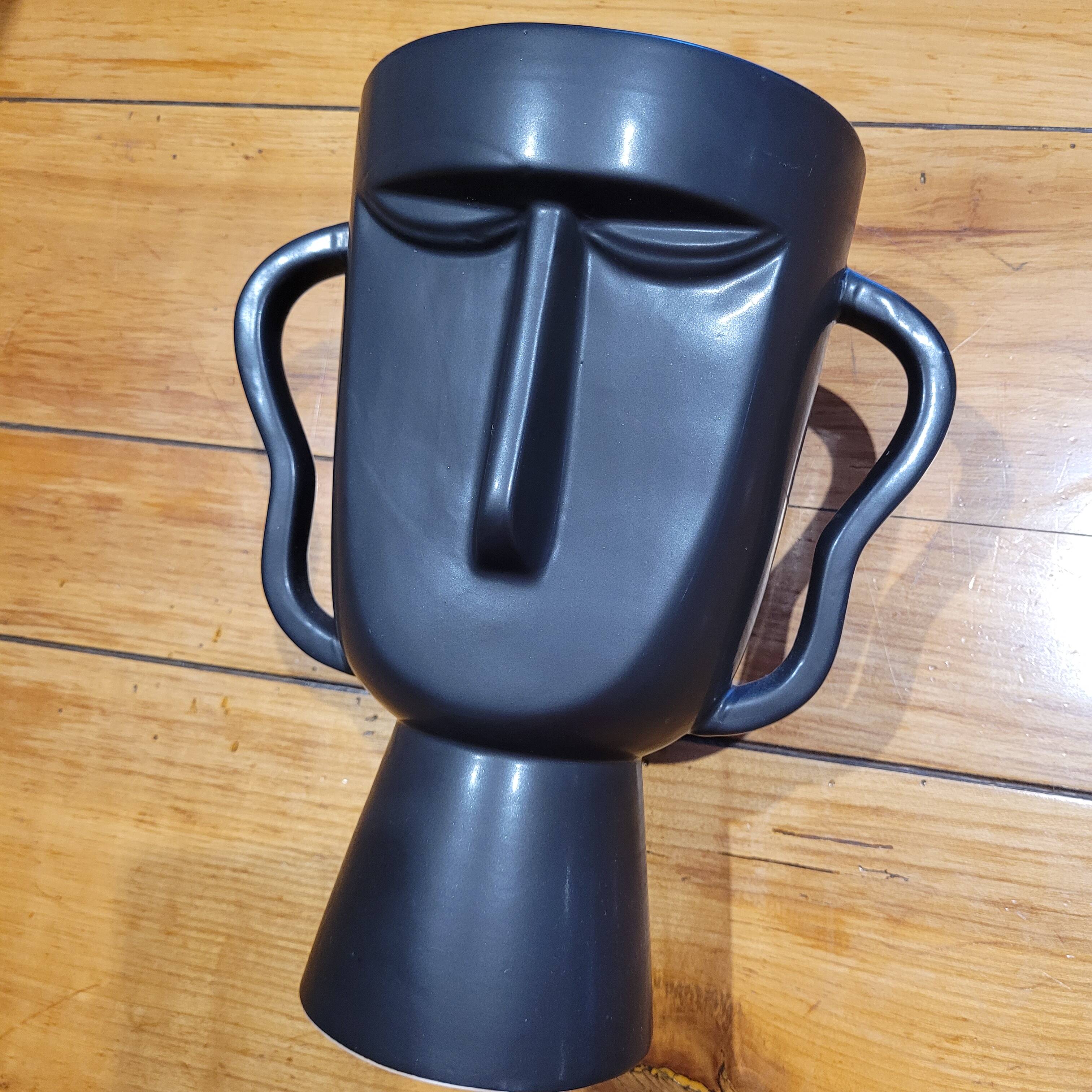 Black tribal face vase