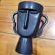 Black tribal face vase