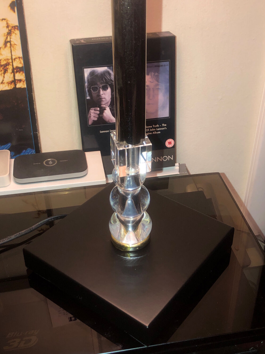 Silver floor lamp with a straight shade.