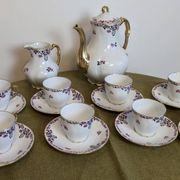 Service à café en porcelaine 18 pièces signé "Aux Lions de Faïence Paris"