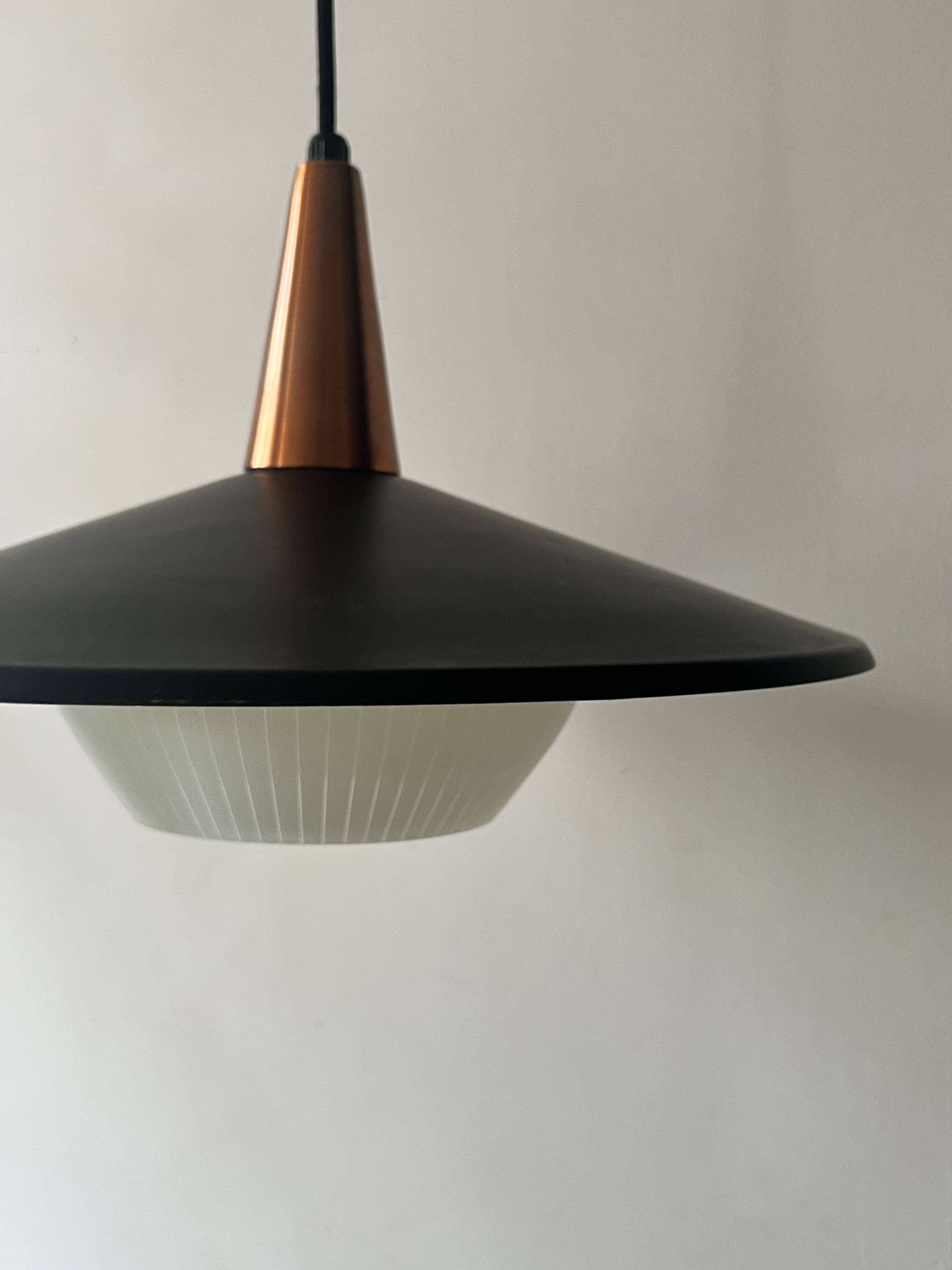 Scandinavian suspension in black metal, copper, and opal glass, 1970s design.