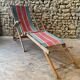 Red and green striped wooden deckchair