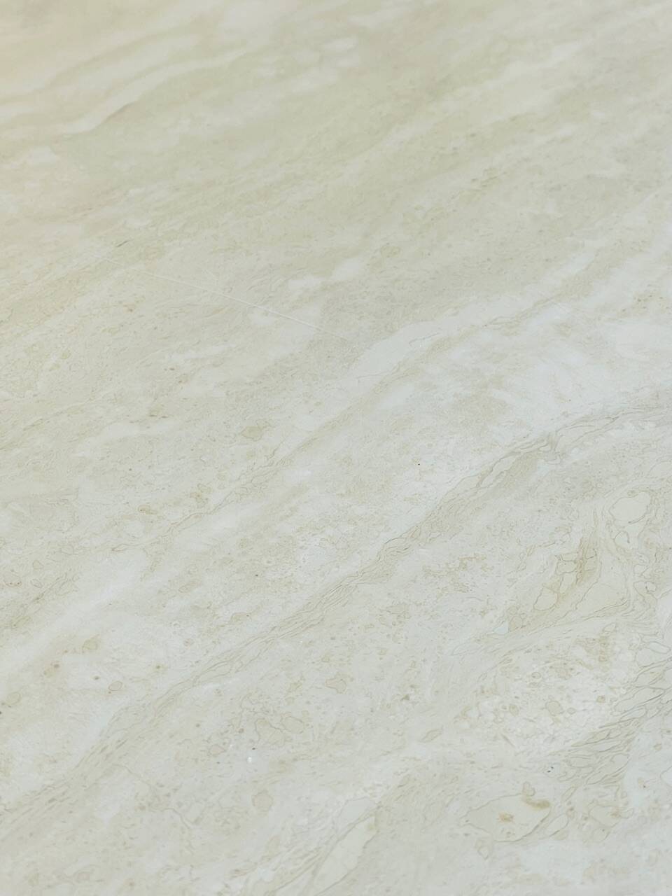 Vintage side table in travertine, circa 1980s.