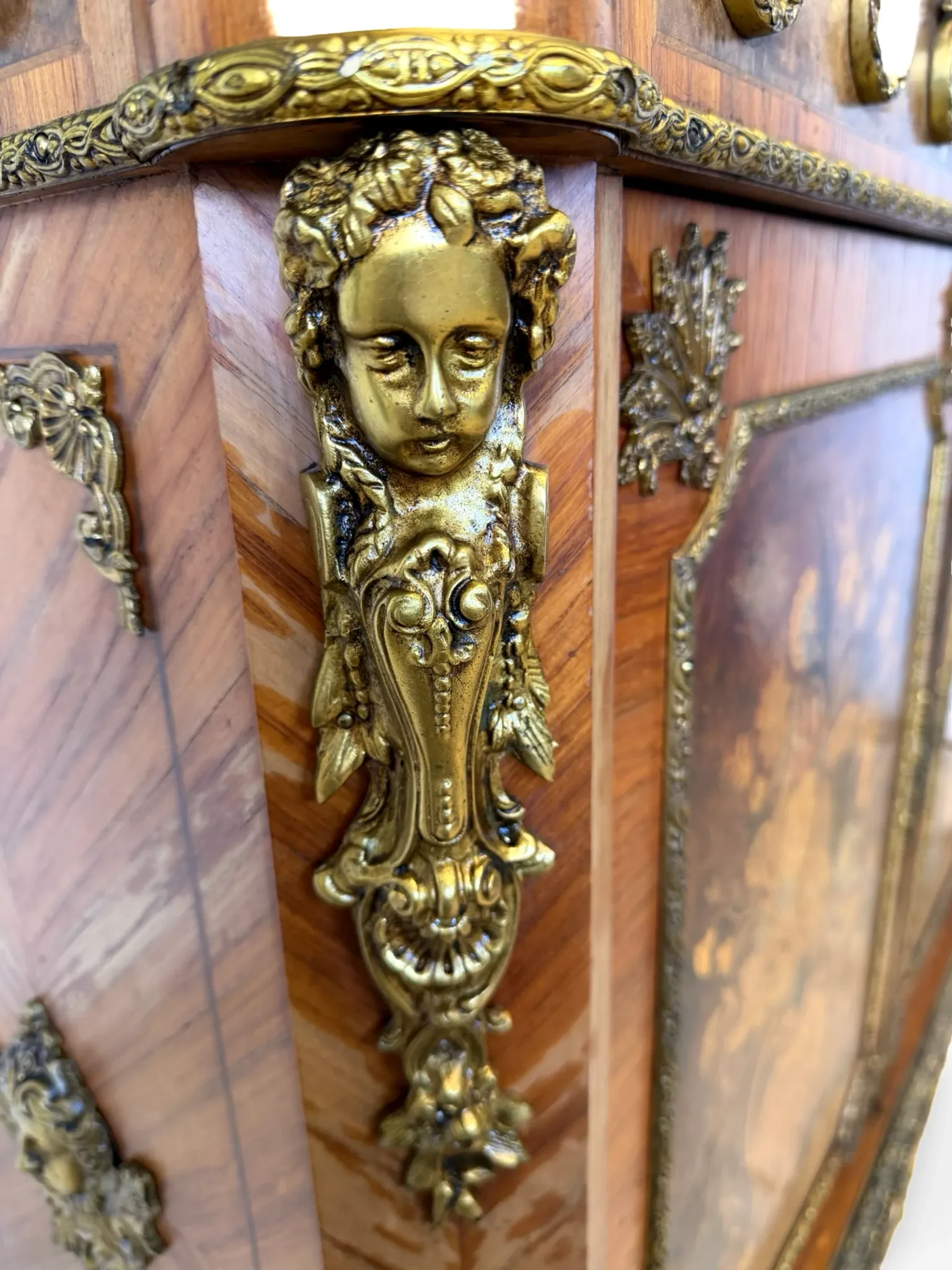An antique French Louis XVI-style marble-top side cabinet