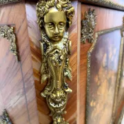 An antique French Louis XVI-style marble-top side cabinet