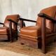 PAIR OF BRUTALIST ARMCHAIRS IN TEAK AND VINTAGE COGNAC LEATHER FROM THE 1950S