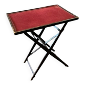 THONET folding table in stained wood, top covered with red felt,