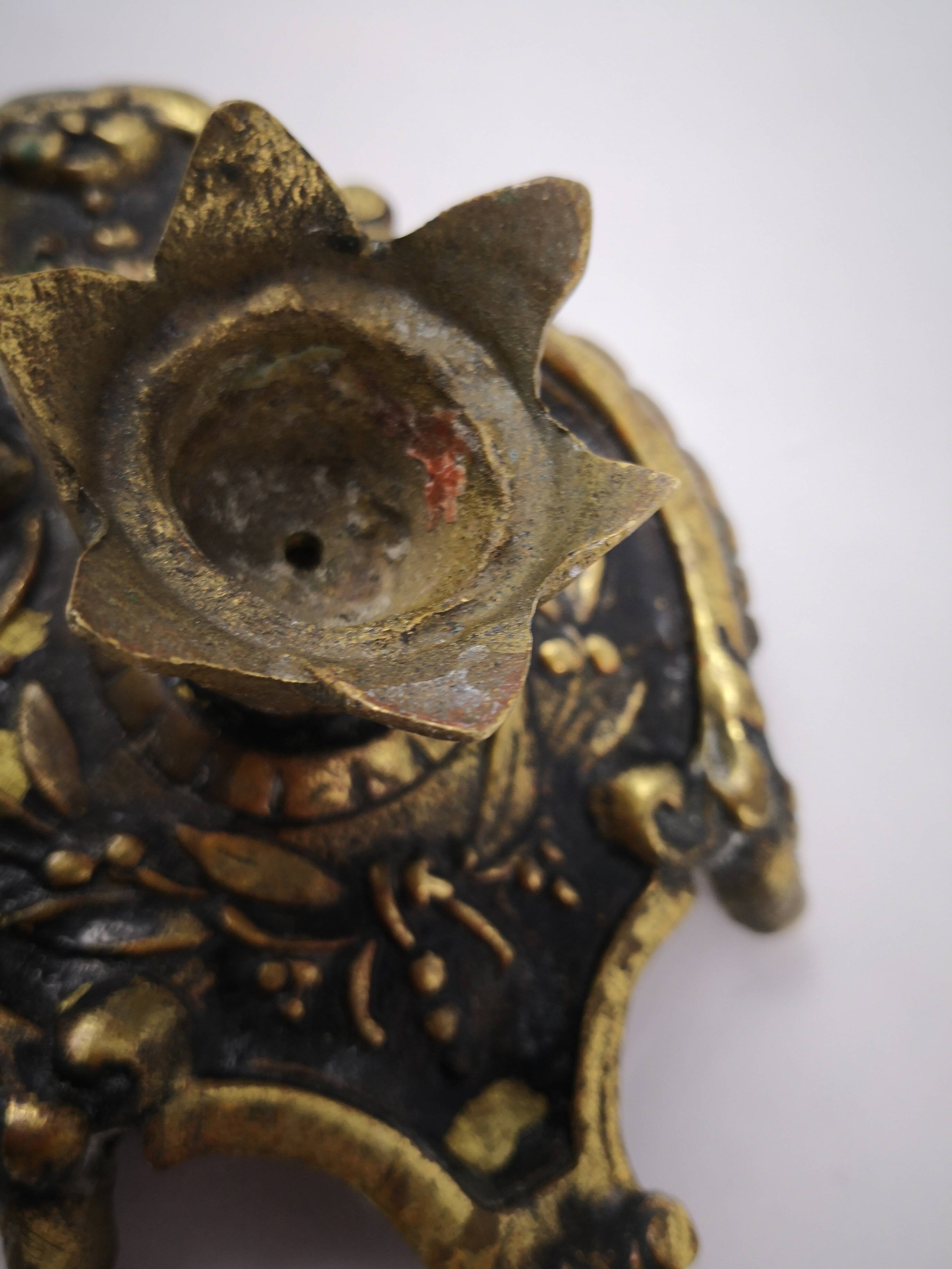 bronze or brass candle holder, cellar level