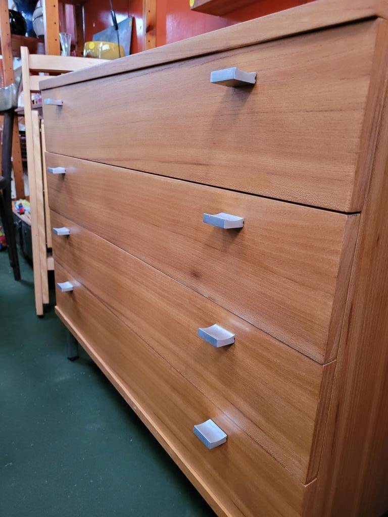 Solid wood chest of drawers with chrome legs from the 1970s.