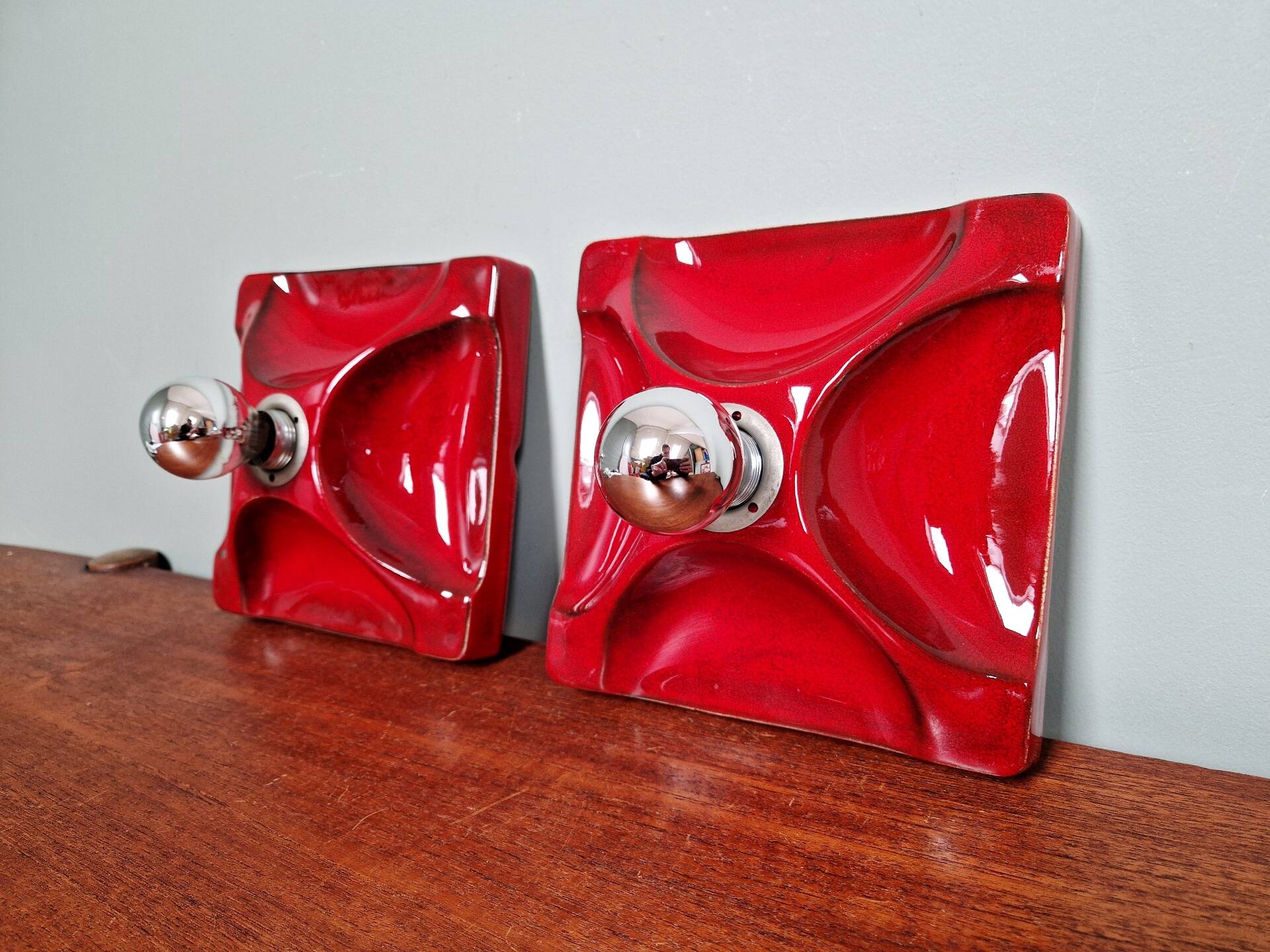Pair of Space Age wall sconces in red ceramic, 1970.
