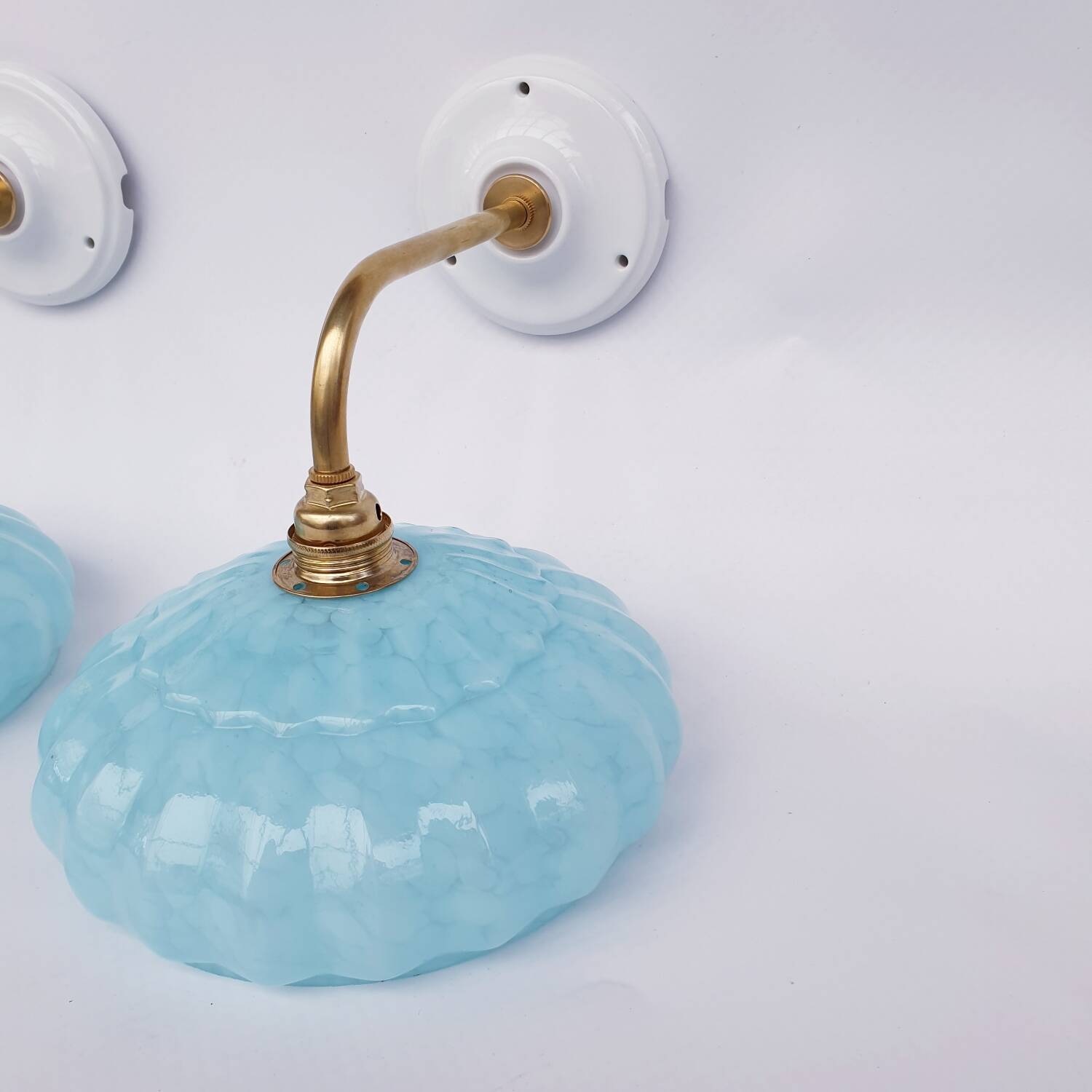 Swan neck wall lights and Clichy glass