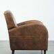 Set of a sheepskin armchair and ottoman finished with matching piping