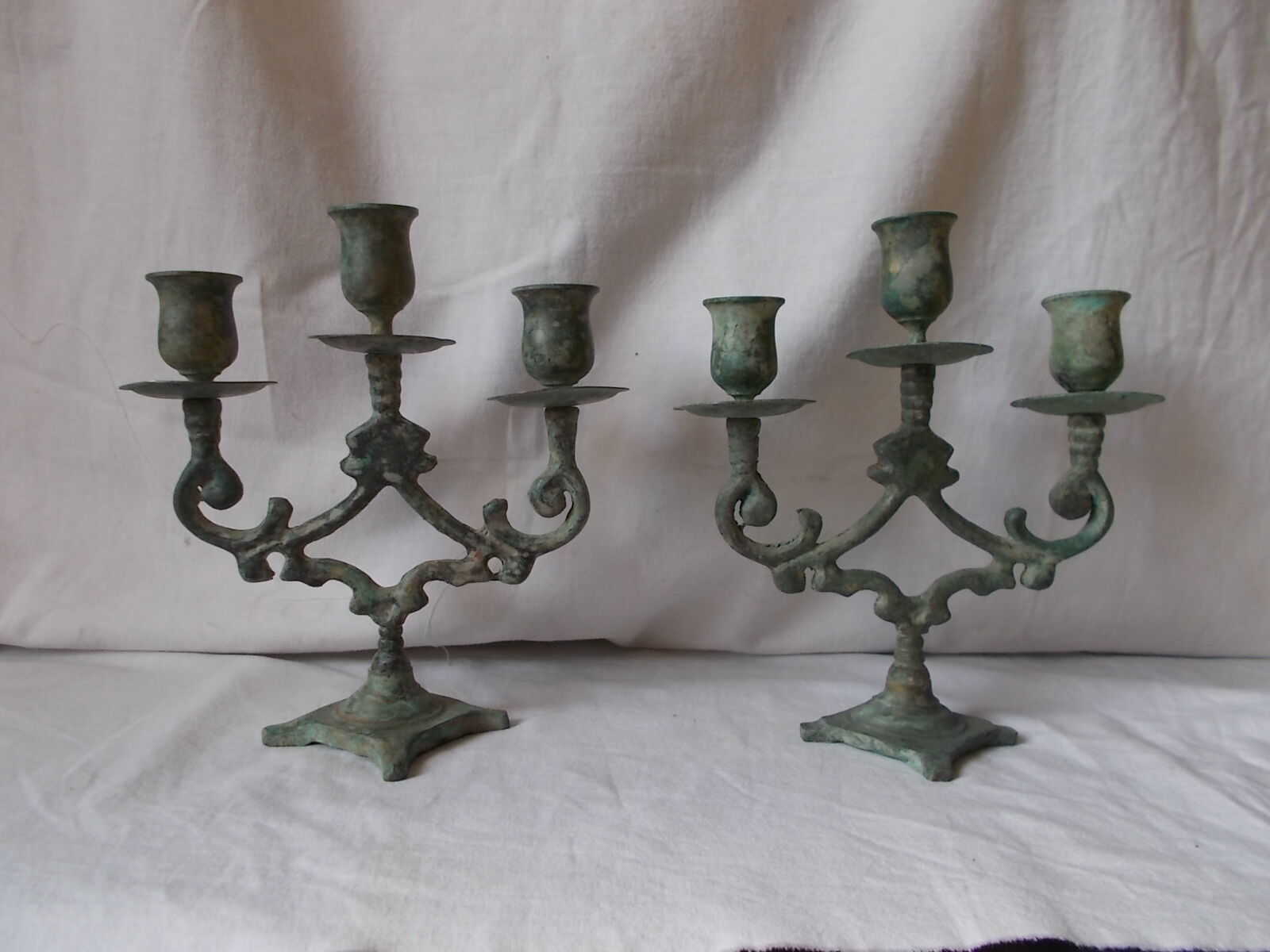 Pair of metal candlesticks patina green grey
