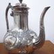 Silver metal teapot in Louis XV style