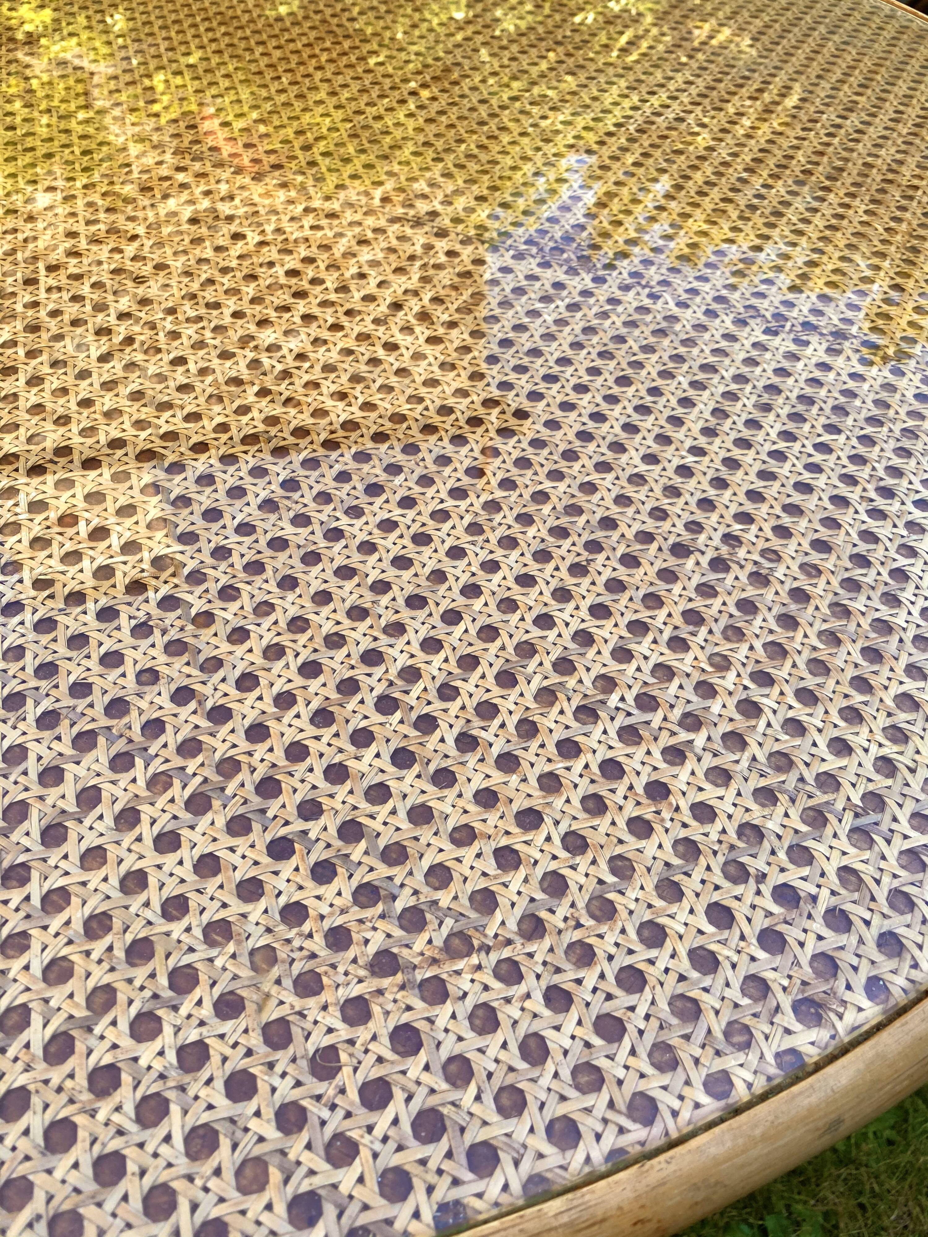 Canned rattan dining table and vintage glass