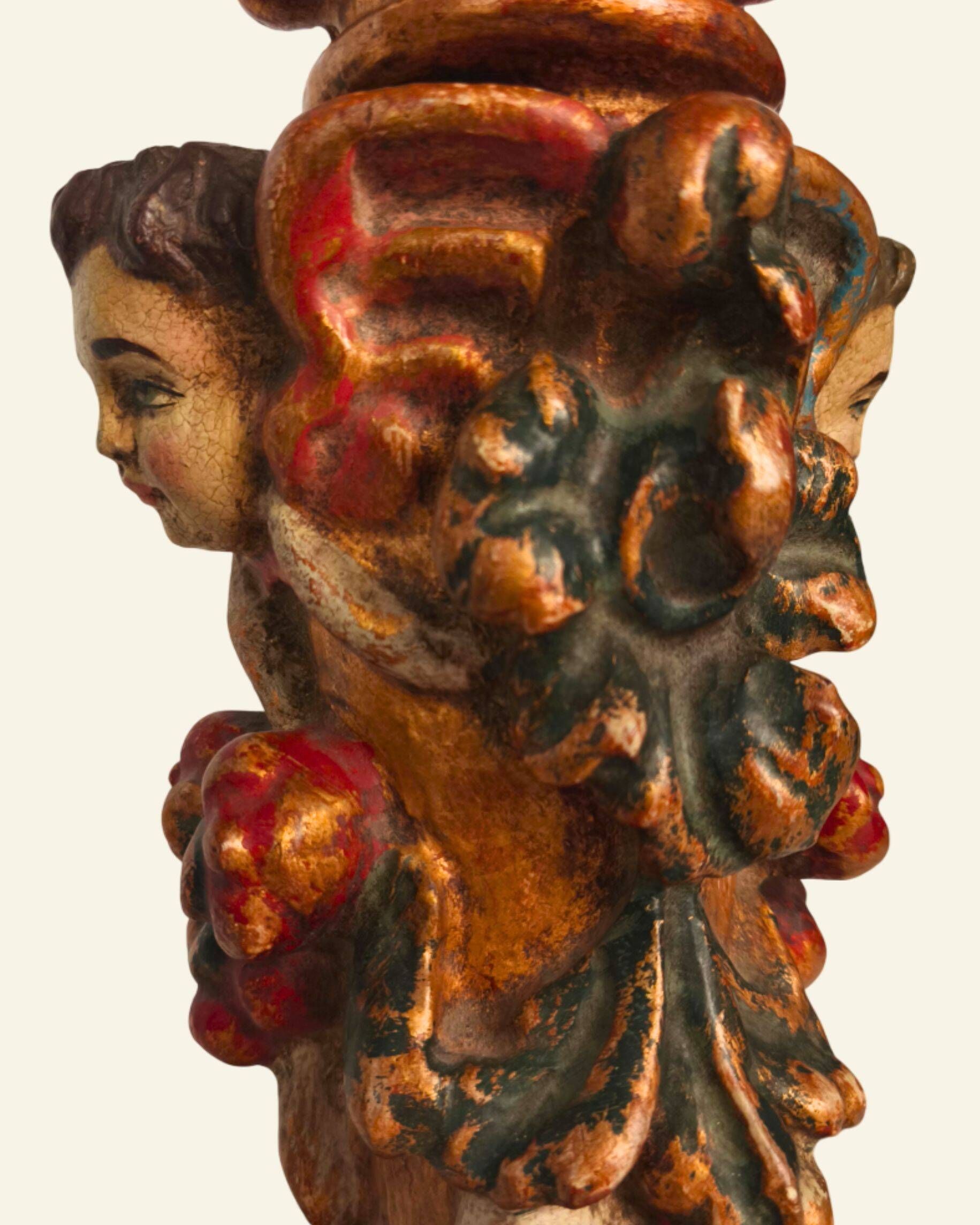 Renaissance table lamp in polychrome carved wood with cherubs.