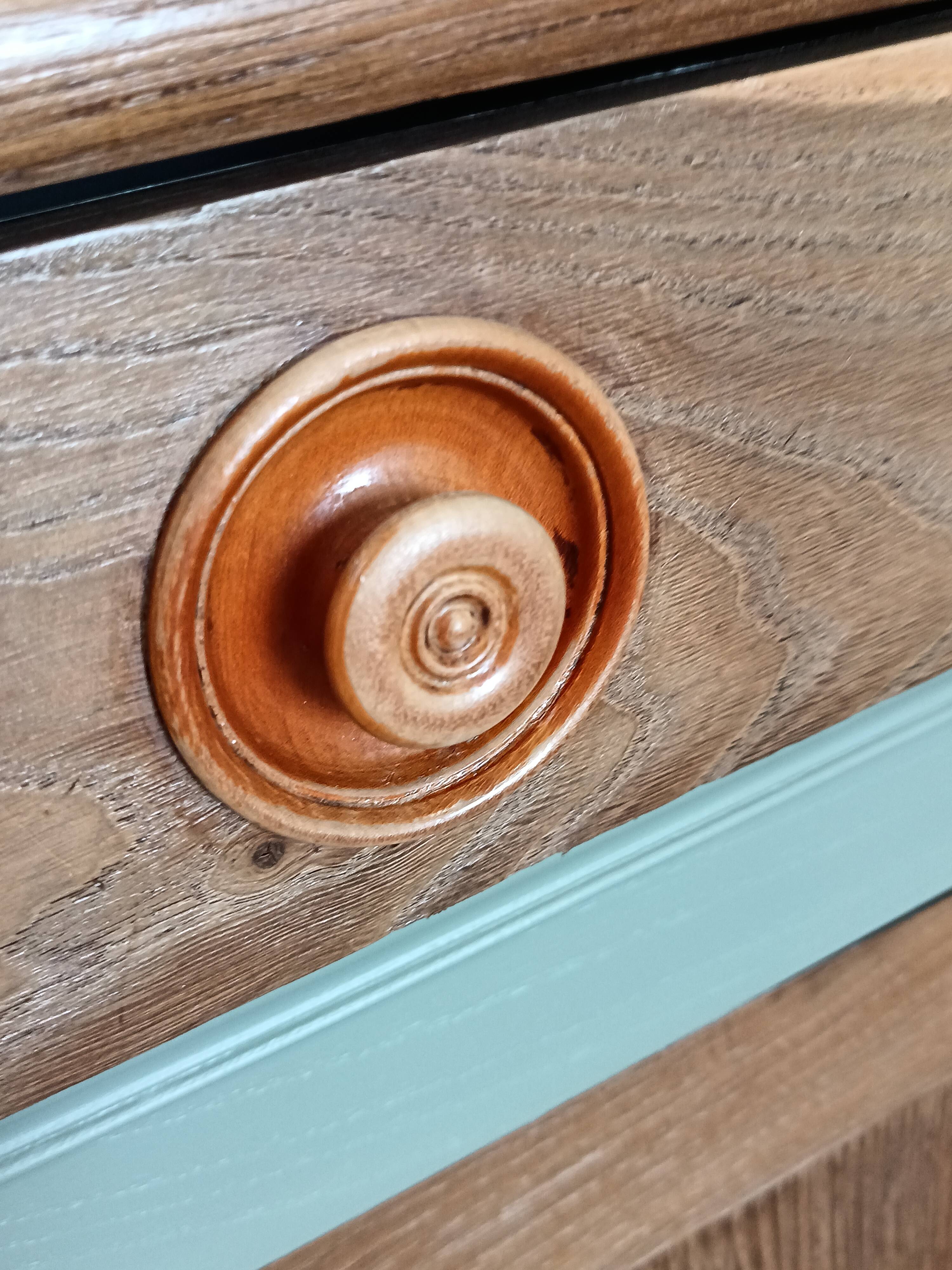 Buffet made of natural wood and bronze green.