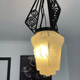 Hanging lamp in wrought iron and pressed molded glass, art nouveau