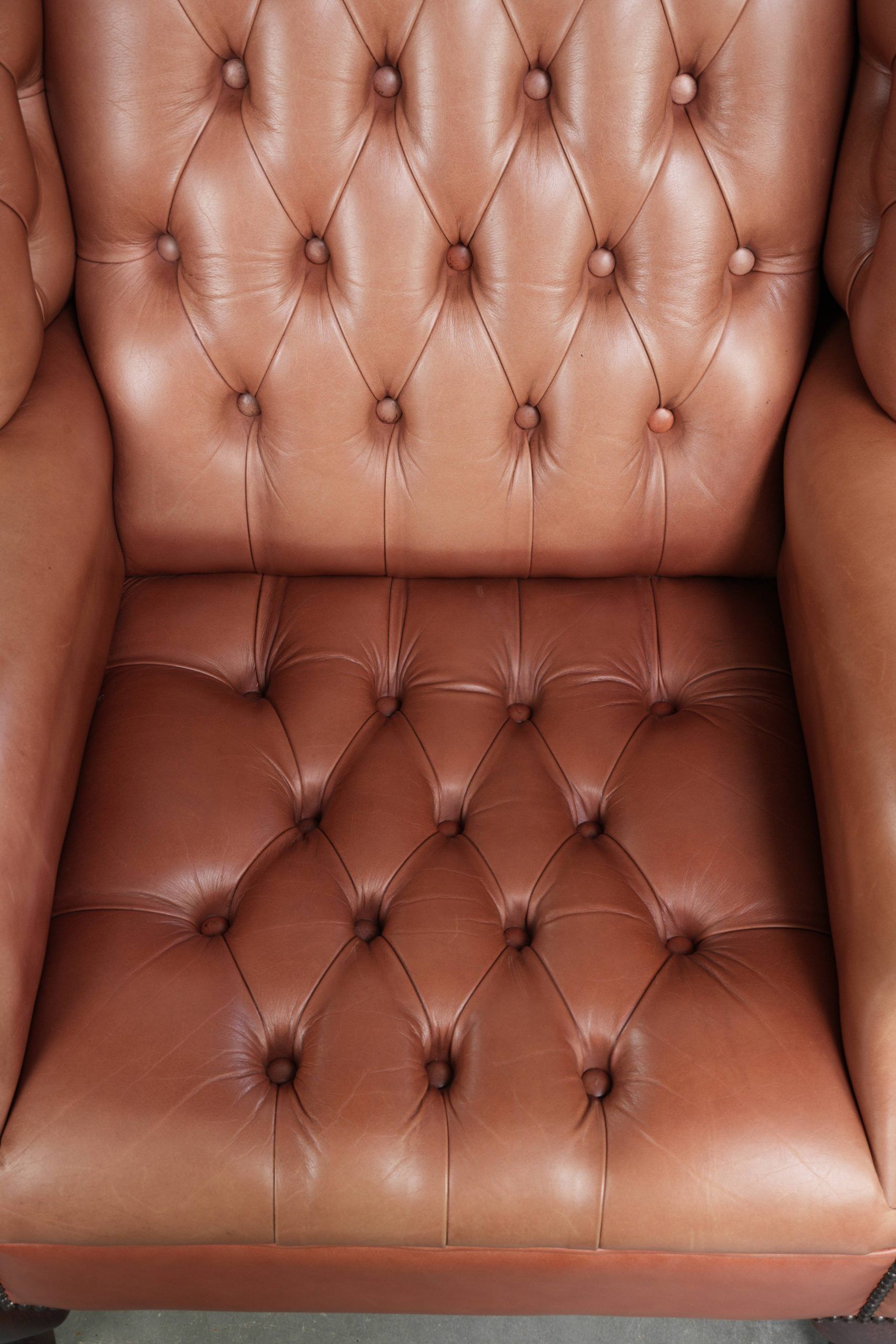 Classic English cowhide button seat chesterfield wingback armchair
