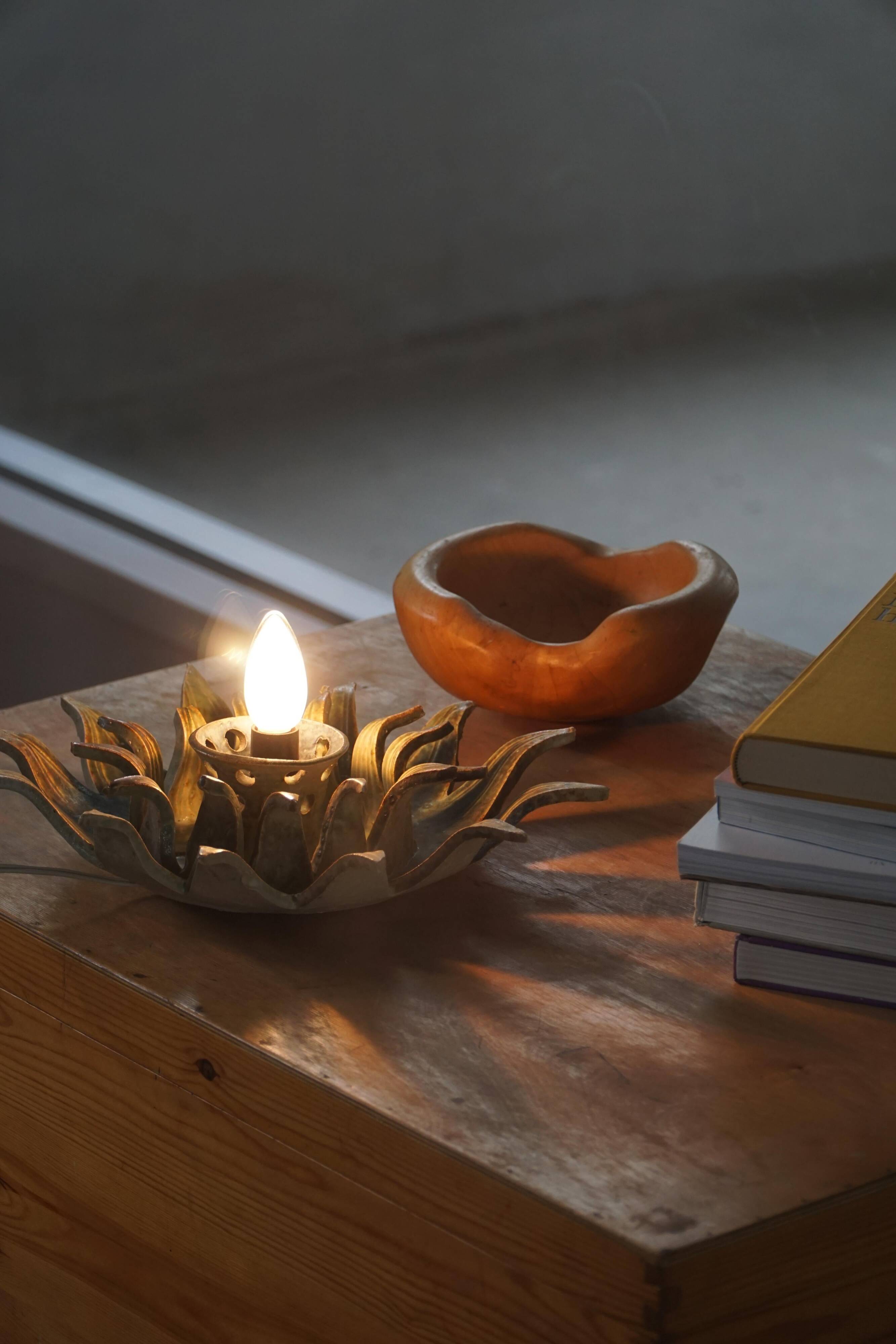 Mid-20th century ceramic sun wall lamp or decorative wall sculpture, 1960s.