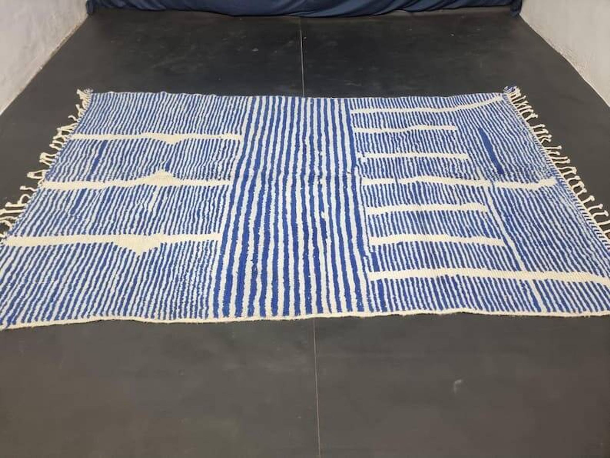 Handwoven Berber rug in blue and white, size 150x250 cm.