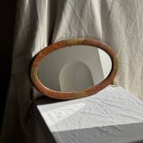 Small oval Art Deco mirror in brown and gold 33x54.