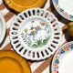 Set of twelve mismatched vintage dessert plates.