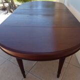 Extendable mahogany table with 6 tapered and fluted legs, Louis XVI style