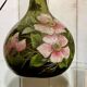 Blown glass lamp painted with a floral design, early 20th century.